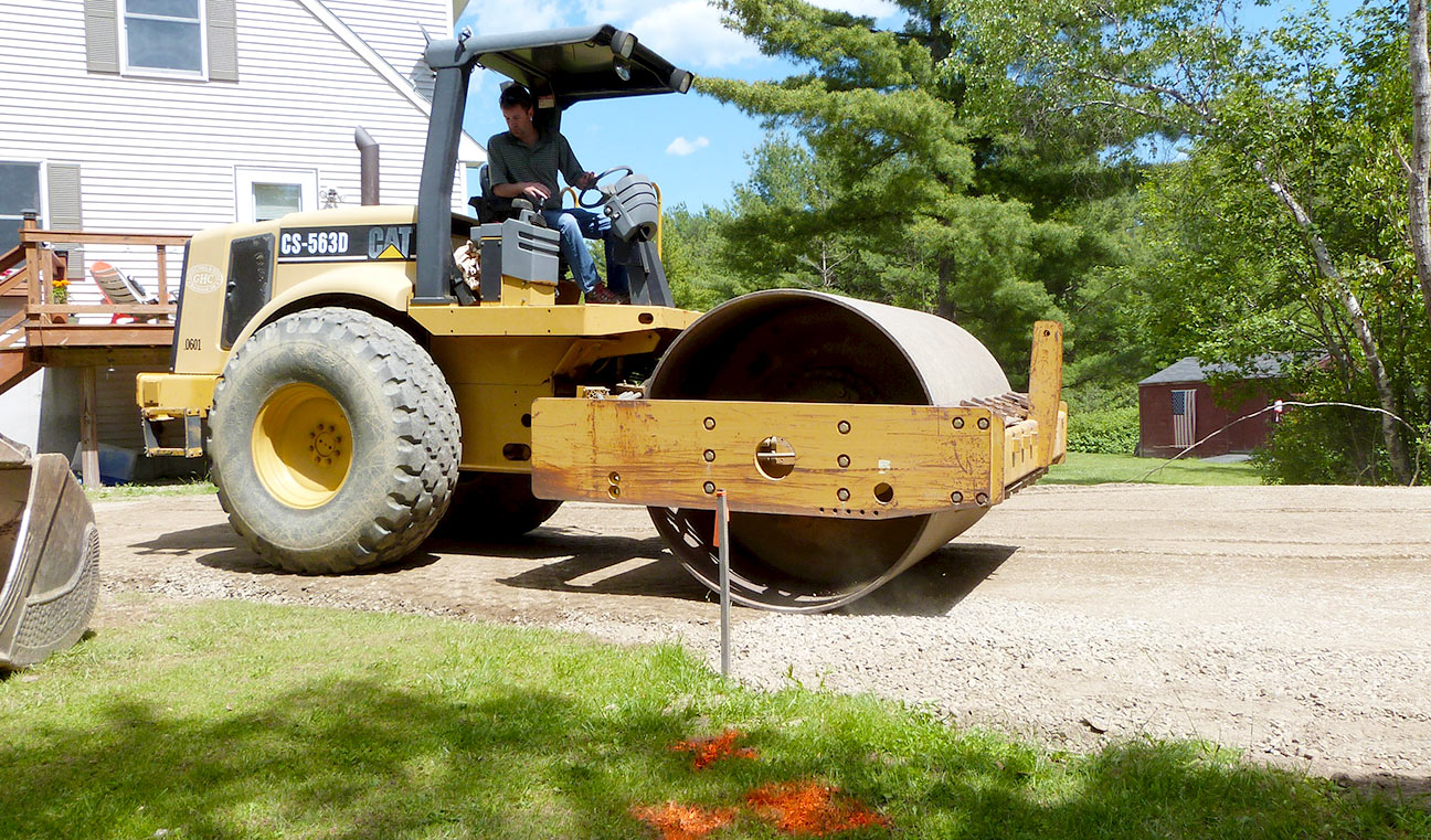 Sam Hall rolling & compacting gravel for a 2 car garage lot in Thomaston, ME